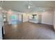Spacious living room with hardwood floors, vaulted ceiling, ceiling fan and open layout to the kitchen at 19 Covey Rise Way, Lillington, NC 27546