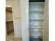 Linen closet with multiple built in shelves and view to walk in closet at 222 Grand Griffon Way, Lillington, NC 27546