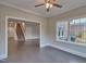 Bright sunroom with view of staircase and backyard at 222 Grand Griffon Way, Lillington, NC 27546