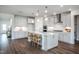 Bright kitchen featuring white cabinets and an island at 271 Circle City Way, Pittsboro, NC 27312