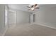 Bright bedroom featuring neutral walls, carpet floors, and a ceiling fan at 316 Spruce Pine Trl, Knightdale, NC 27545