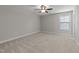 Bedroom with neutral walls, carpet, ceiling fan, and window at 316 Spruce Pine Trl, Knightdale, NC 27545