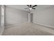 A bedroom with neutral walls, a ceiling fan, and a view of an open doorway at 316 Spruce Pine Trl, Knightdale, NC 27545