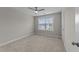 Carpeted bedroom featuring neutral walls, window with blinds, and a ceiling fan at 316 Spruce Pine Trl, Knightdale, NC 27545