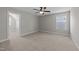 Bedroom with neutral walls, carpet flooring, ceiling fan, and an attached closet at 316 Spruce Pine Trl, Knightdale, NC 27545