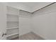 Walk-in closet with custom shelving and rod for organization at 316 Spruce Pine Trl, Knightdale, NC 27545