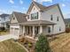 Beautiful home with a welcoming front porch, swing and well-manicured landscaping, complementing its classic exterior at 316 Spruce Pine Trl, Knightdale, NC 27545
