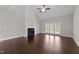 Living room with fireplace, hardwood floors, and access to the patio at 316 Spruce Pine Trl, Knightdale, NC 27545