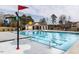 Community swimming pool with play feature and nearby covered picnic area at 316 Spruce Pine Trl, Knightdale, NC 27545