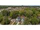 An aerial view captures modern homes surrounded by lush trees, offering a glimpse of the tranquil neighborhood at 339 1/2 Mulberry St, Raleigh, NC 27604