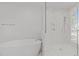Bathroom with free standing tub, glass shower and tiled floor at 339 1/2 Mulberry St, Raleigh, NC 27604