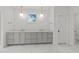 Elegant bathroom featuring double vanity, marble countertop, and modern lighting at 339 1/2 Mulberry St, Raleigh, NC 27604