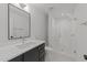 Modern bathroom featuring a glass shower, sleek vanity and hexagon tiled floors at 339 1/2 Mulberry St, Raleigh, NC 27604