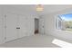 Bright bedroom with carpet, closet and backyard view at 339 1/2 Mulberry St, Raleigh, NC 27604