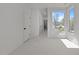 Bedroom featuring carpet, a closet, and a large window with natural lighting at 339 1/2 Mulberry St, Raleigh, NC 27604