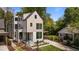 Striking two-story modern home features clean lines, large windows, and manicured landscaping at 339 1/2 Mulberry St, Raleigh, NC 27604