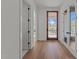 Hallway with hardwood floors, white walls, and stylish doors leading to various rooms at 339 1/2 Mulberry St, Raleigh, NC 27604
