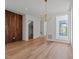Spacious living room showcasing hardwood floors and a wood accent wall at 339 1/2 Mulberry St, Raleigh, NC 27604