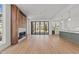 Bright living room with hardwood floors, modern fireplace and access to outdoor patio at 339 1/2 Mulberry St, Raleigh, NC 27604