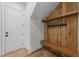 Mudroom features wood detailing with coat hooks and a bench at 339 1/2 Mulberry St, Raleigh, NC 27604