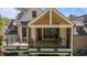 The covered deck with modern railing and expansive sliding doors provides a great spot for outdoor relaxation at 339 1/2 Mulberry St, Raleigh, NC 27604