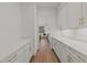 Pantry offers ample storage space with white cabinets and brass hardware at 339 1/2 Mulberry St, Raleigh, NC 27604