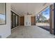 Covered patio with a stone floor, fireplace, and outdoor ceiling fan at 339 1/2 Mulberry St, Raleigh, NC 27604