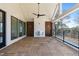 Spacious covered porch with a wooden tile floor, fireplace and black ceiling fan at 339 1/2 Mulberry St, Raleigh, NC 27604