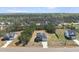 Scenic aerial shot of a gray two-story home in a wooded area with lush greenery all around at 40 Misty Mountain, Spring Hope, NC 27882