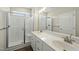 Bathroom featuring a double vanity, modern fixtures, and glass enclosed shower with a bench at 40 Misty Mountain, Spring Hope, NC 27882