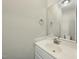 Clean half bathroom featuring a modern vanity, sink, and a mirror, perfect for guests and everyday use at 40 Misty Mountain, Spring Hope, NC 27882