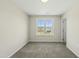Bedroom featuring neutral carpet and a large window with neighborhood views at 40 Misty Mountain, Spring Hope, NC 27882