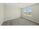 Bedroom featuring neutral carpet and a large window that lets in plenty of natural light at 40 Misty Mountain, Spring Hope, NC 27882
