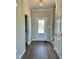 Inviting entryway with hardwood floors, white trim, and a front door with decorative frosted glass at 40 Misty Mountain, Spring Hope, NC 27882