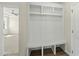 Entryway featuring a custom built in shelving unit, bench, and coat hooks for convenient storage at 40 Misty Mountain, Spring Hope, NC 27882