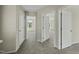 Hallway with multiple doorways that provide access to the bedrooms at 40 Misty Mountain, Spring Hope, NC 27882