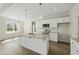 Bright kitchen featuring granite countertops, white cabinets, and stainless steel appliances at 40 Misty Mountain, Spring Hope, NC 27882