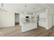 Bright kitchen featuring granite countertops, white cabinets, and stainless steel appliances at 40 Misty Mountain, Spring Hope, NC 27882