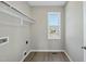 Simple laundry room with a window for natural light and a hanging rack at 40 Misty Mountain, Spring Hope, NC 27882