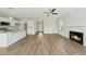 Open concept living room with a fireplace, ceiling fan, and wood flooring at 40 Misty Mountain, Spring Hope, NC 27882