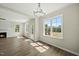 Bright living room featuring hardwood floors, a fireplace, and large windows that let in plenty of natural light at 40 Misty Mountain, Spring Hope, NC 27882