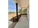 Inviting front porch showcasing wooden support beams, railing, and brick accents, offering a welcoming outdoor space at 40 Misty Mountain, Spring Hope, NC 27882