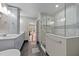 Modern bathroom with double vanity, walk-in shower, and dark tile floors at 5317 Burning Oak Ct, Raleigh, NC 27606