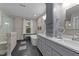 Elegant bathroom with double sink vanity, soaking tub, and decorative tile flooring at 5317 Burning Oak Ct, Raleigh, NC 27606