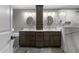 Elegant bathroom with double sinks, marble countertop, decorative tile and walk-in shower at 5317 Burning Oak Ct, Raleigh, NC 27606