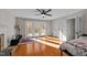 Bright bedroom featuring hardwood floors, and access to an outdoor patio at 5317 Burning Oak Ct, Raleigh, NC 27606