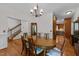Formal dining room with traditional furnishings, chandelier and hardwood floors at 5317 Burning Oak Ct, Raleigh, NC 27606