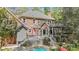 Expansive home with a pool, decks, patio, sauna, and lush landscaping, perfect for outdoor living and entertaining at 5317 Burning Oak Ct, Raleigh, NC 27606