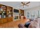 Gathering room with fireplace, built-in shelves, and hardwood floors at 5317 Burning Oak Ct, Raleigh, NC 27606