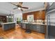 Well-lit kitchen with ample counter space, stainless steel appliances, and hardwood floors at 5317 Burning Oak Ct, Raleigh, NC 27606
